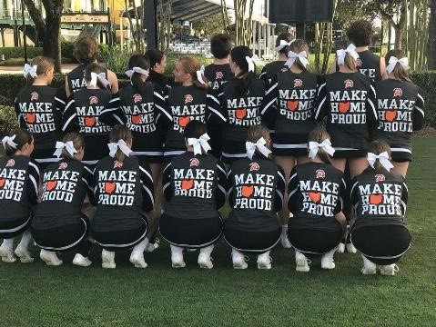 cheerleaders wearing matching shirts